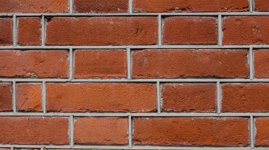 Soyut tuğla duvar arkaplanı, yakın plan. Kırmızı tuğla duvar dokusu.