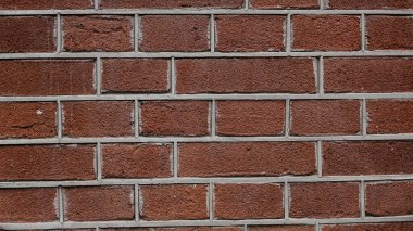 Soyut tuğla duvar arkaplanı, yakın plan. Kırmızı tuğla duvar dokusu.