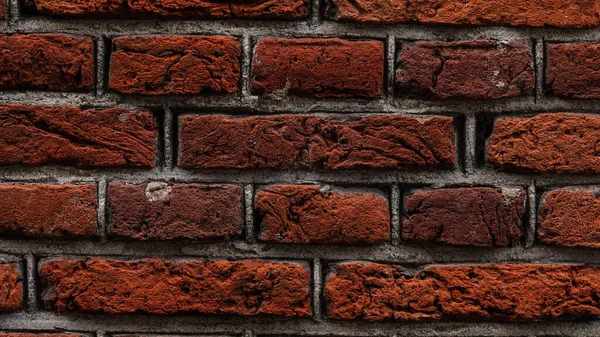 Streszczenie ceglanego tła, zbliżenie. Struktura ściany z czerwonej cegły. — Zdjęcie stockowe