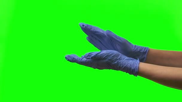 Doctors female hands in blue gloves are clapping. Green screen. Close up — Stock Video