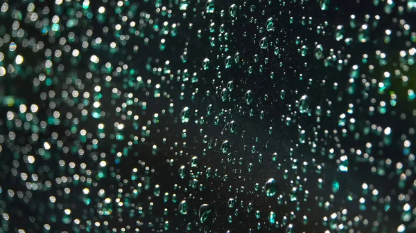 Drops of rain on a black background. Close up — Stock Photo, Image