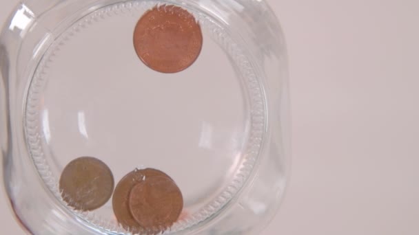 Slow Motion Worm Eye View Pennies Bring Dropped Glass Jar — Stock Video