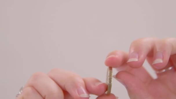 Worm Eye Slow Motion Shot Someone Spinning Pound Coin Screen — Stock Video