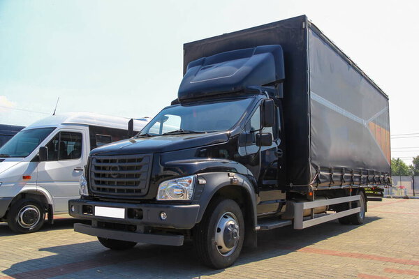 black truck with awning for delivery and transportation of goods