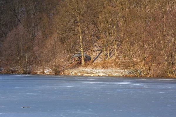 Frozen pond with ice. Landscape in Marian Valley in Brno, Czech Republic.