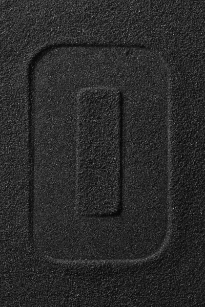 Egy fekete homokra préselt levél lenyomata.. — Stock Fotó