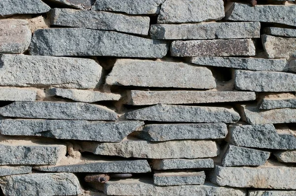 Detail van een stenen muur achtergrond — Stockfoto