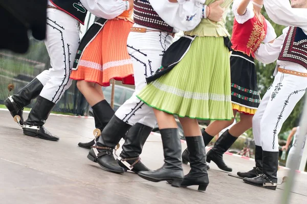 Fragment of Slovak folk dance with colorful clothes Stock Picture