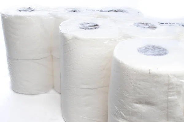 Три Упаковки Туалетной Бумаги Запечатанные Пластик Белом Фоне — стоковое фото