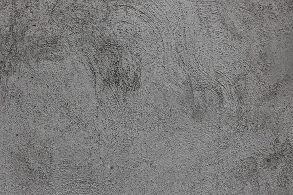 회색 회반죽 벽에 있는 울퉁불퉁 한 곡선들 — 스톡 사진