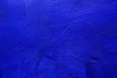 Blue colored abstract wall background with textures of different shades of blue