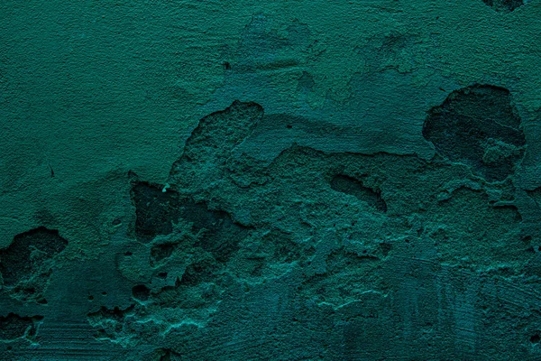 Petrol colored wall texture background with textures of different shades of teal