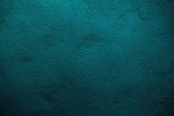 Petrol colored wall texture background with textures of different shades of teal