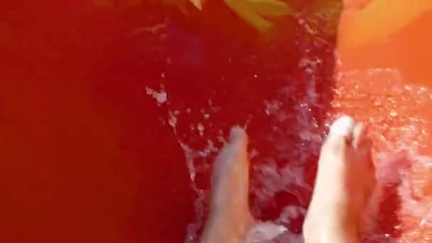 A man rolls down the waterslide first person view pov — Stock Video