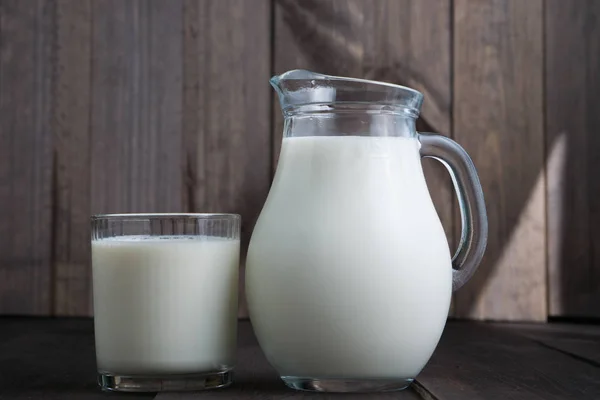 Jug and glass with milk — Stock Photo, Image