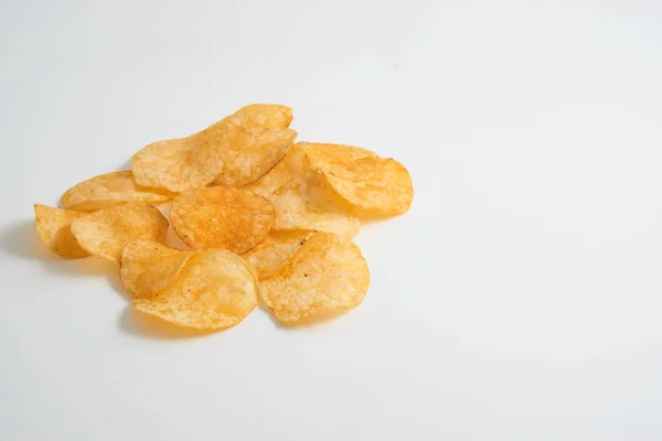Small pile of potato crisps on white — Stock Photo, Image