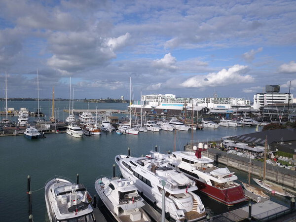 Viaduct Harbour, Auckland / New Zealand - December 29, 2019: The beautiful scene surrounding the Viaduct harbour, Princess Wharf area, marina bay, Wynyard, St Marys Bay and Westhaven, all of New Zealands North Island