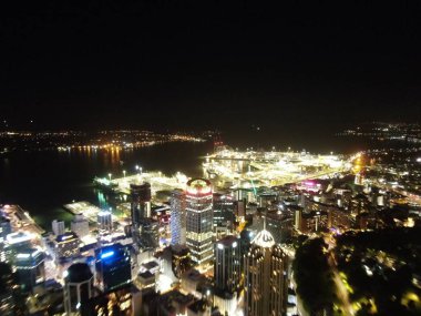 Viaduct Harbour, Auckland / New Zealand - December 31, 2019: The iconic Skytower landmark of Auckland City and its surrounding buildings