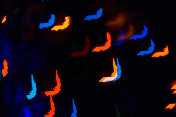 A cloud of glowing bats, multicolored highlights and glowing