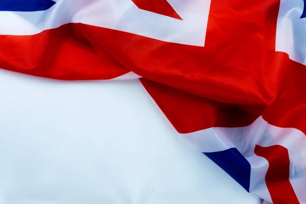 Flag of UK, British flag, close up. Top view, copy space for tex