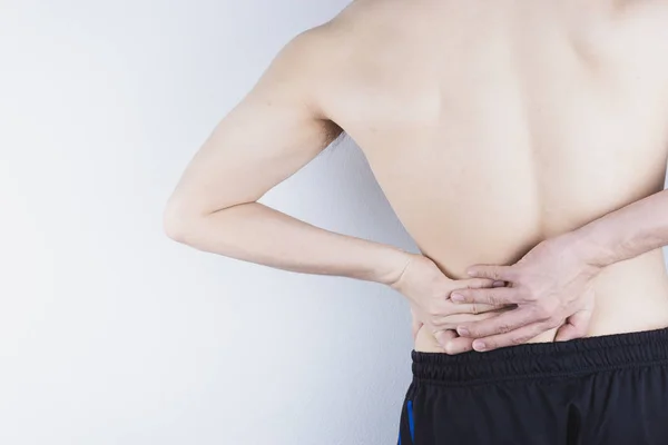 Closeup man suffering from lower back pain. Health care and medi — Stock Photo, Image