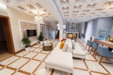 Interior view of a large living room in a country house.