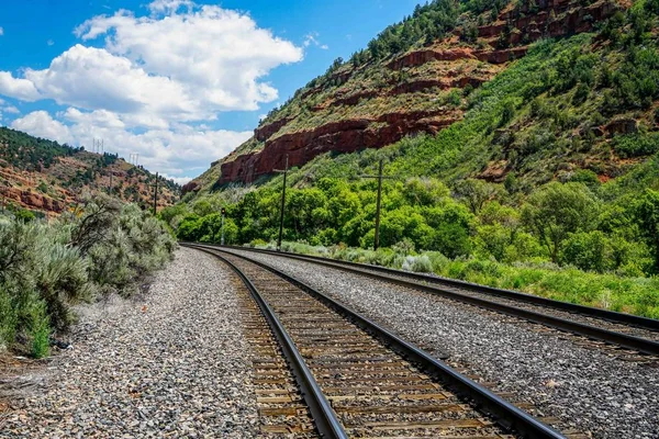 Railroad tracks running east and west across Utah moving products around the country.