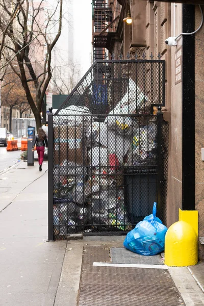 New York, NY / United States - Jan. 4, 2020: Vertical view of garbage piled up in front of an apartment. — Stok fotoğraf