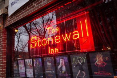 New York, NY / United States - March 3, 2020: Closeup on the window and sign of The Stonewall Inn. Gay bar & National Historic Landmark, site of the 1969 riots that launched the gay rights movement. clipart