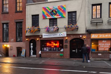 New York, NY / United States - March 3, 2020: Landscape view of the iconic  Stonewall Inn. Gay bar & National Historic Landmark, site of the 1969 riots that launched the gay rights movement. clipart