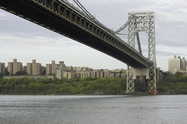 Fort Lee, NJ / United States - May 14, 2020: A landscape view of the iconic George Washington Bridge and Manhattan's Washington Heights.