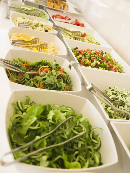 salad bar with a variety of fresh vegetables