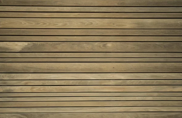 Närbild av komposit trall. Trä plankor. Brännugn torkat trä virke textur bakgrund. Timmer trägolv vägg. (selektiv fokus) — Stockfoto
