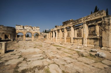 Hierapolis City Ruins. The ruins of the ancient city of Hierapolis is located adjacent to the hot springs of Pamukkale in Turkey. The site is a UNESCO world heritage site. clipart