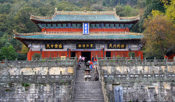 WUDANG SHAN, HUBEI, CHINA - NOV 8, 2007: Pilgrims at the entrance to the Purple Cloud Palace (Zhi Xiao gong) - ancient temple is a center of the Taoist Association of Wudang Mountain
