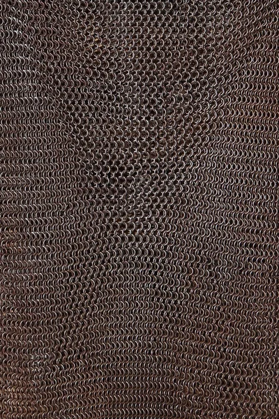 Macro photo of chain mail. Weaving of iron. Metal texture.