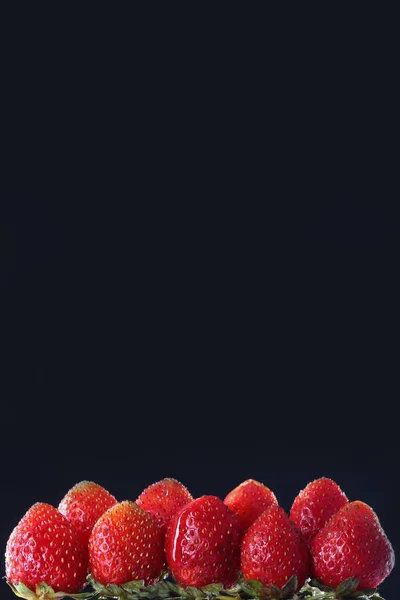 Strawberries on a black background. Copy space. Place for text.The concept of still life. — Stock Photo, Image