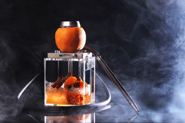 A square flask for a hookah based on sea buckthorn and orange. A transparent flask of a hookah. — Stock Photo, Image