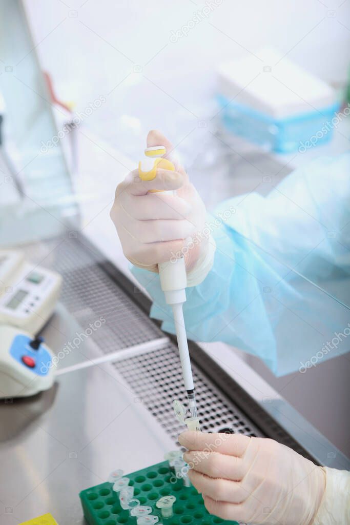 Chemical analysis studies. Lab technician's hands close - up 2019-nCoV. The threat of a coronavirus epidemic.Copy space. Top view