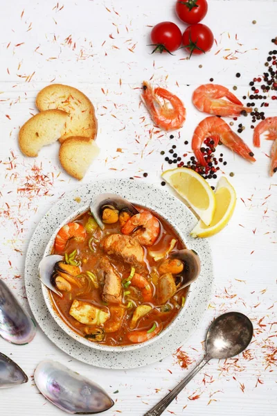 French seafood soup. Bouillabaisse ear of seafood. Food French sailors. White background, top view. Free space for inscriptions. Still life concept. — Stockfoto