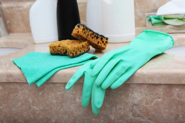 Gloves for cleaning the bathroom. Items of sanitary hygiene and disinfection. Copy space.