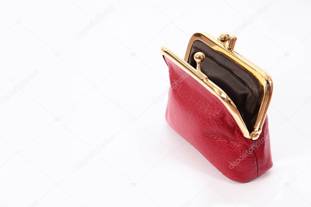 Red open wallet without money on a white background. An isolated object. Copy of the space. The concept of the financial crisis. Top view.