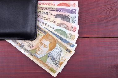 Black wallet with Honduran money  clipart