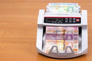 Cayman Adaları Bir sayma makinesinde Dolar