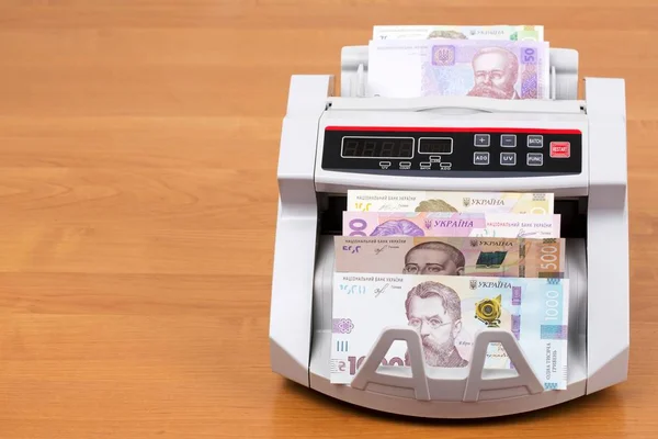 Ukrainian money in a counting machine