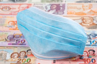 Bolivya parası üzerinde koruyucu maske