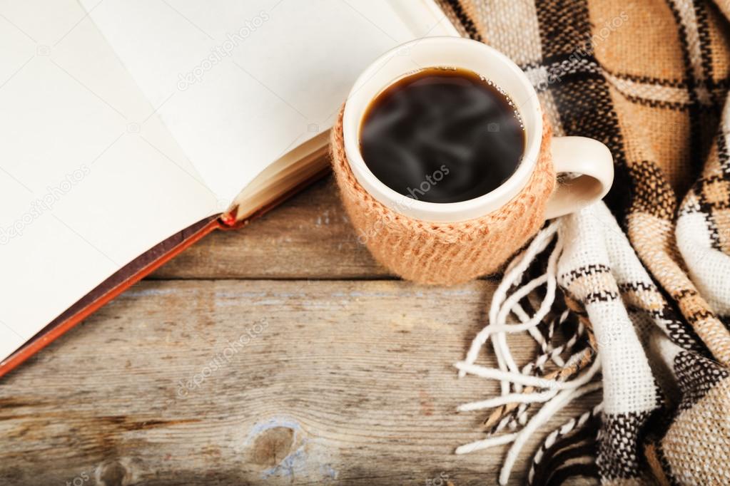 Hot drink in a large cup, book, plaid