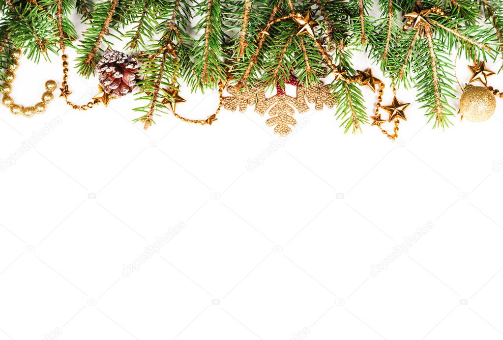 The branches of spruce with decorations on a white background