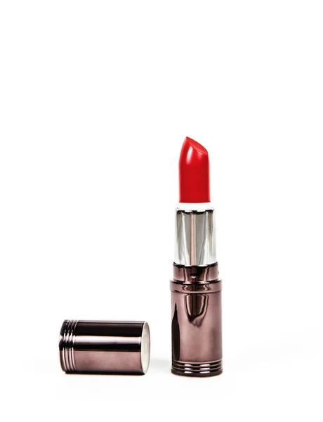 Rode lippenstift in glanzende verpakking op een witte achtergrond — Stockfoto