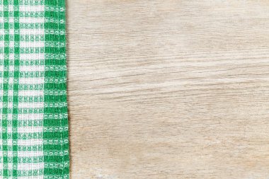 Ahşap yüzey damalı bir bezle. Mutfak girişleri kavramı